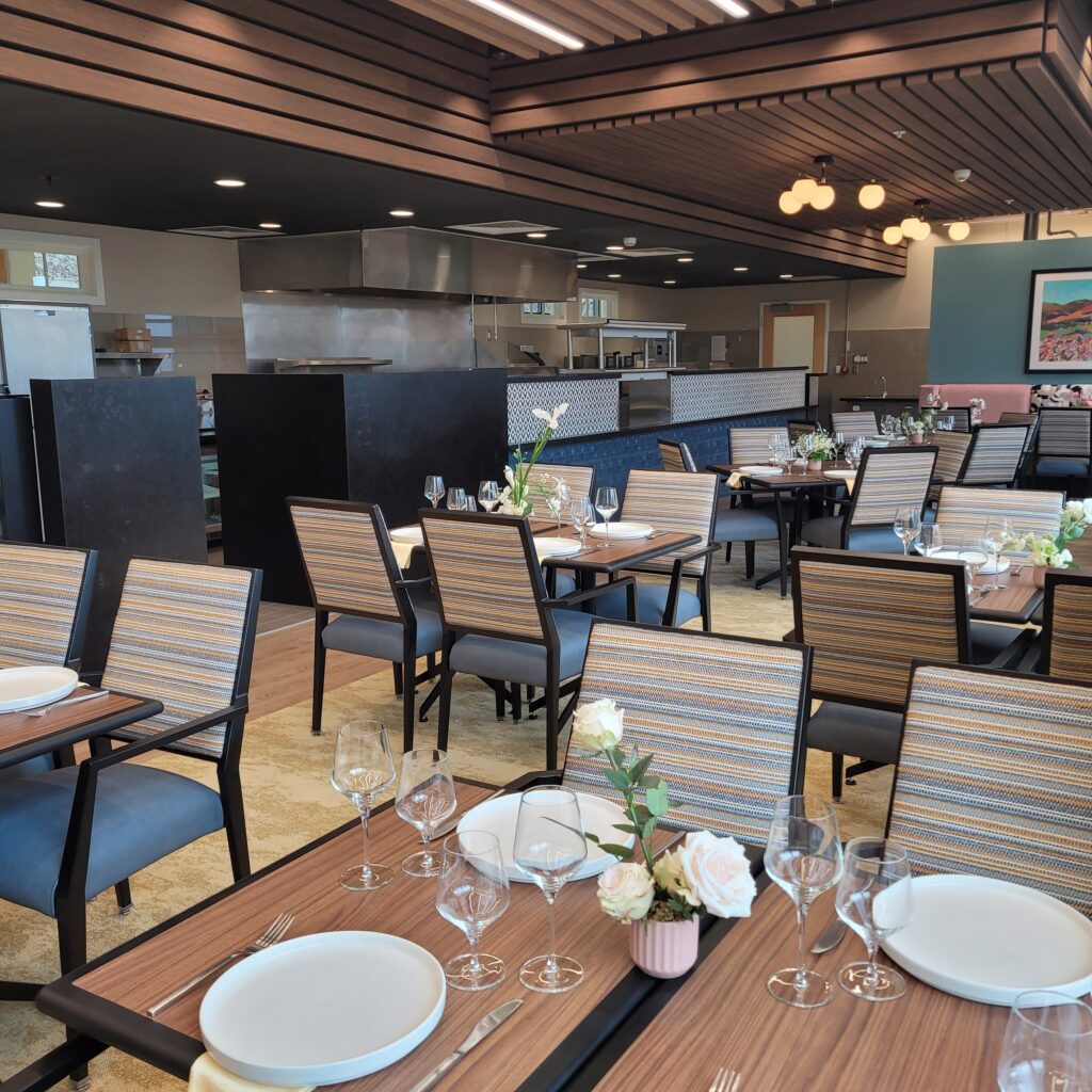 Commercial Senior Living Dining Room with Set Tables and Pendant Lighting - Commercial Food Service Design by Rose's Equipment