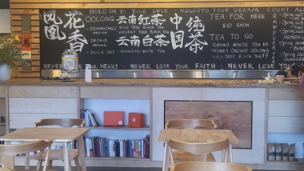 Tea Shop Dining Area with Chalkboard Menu and Beverage Service Counter - Commercial Food Service Design